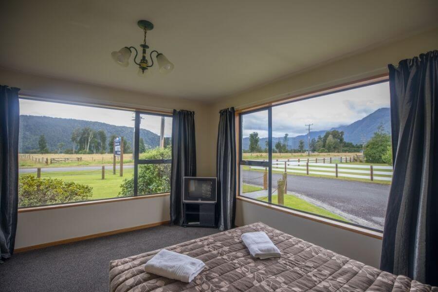 Bedroom with tv and views of mountains