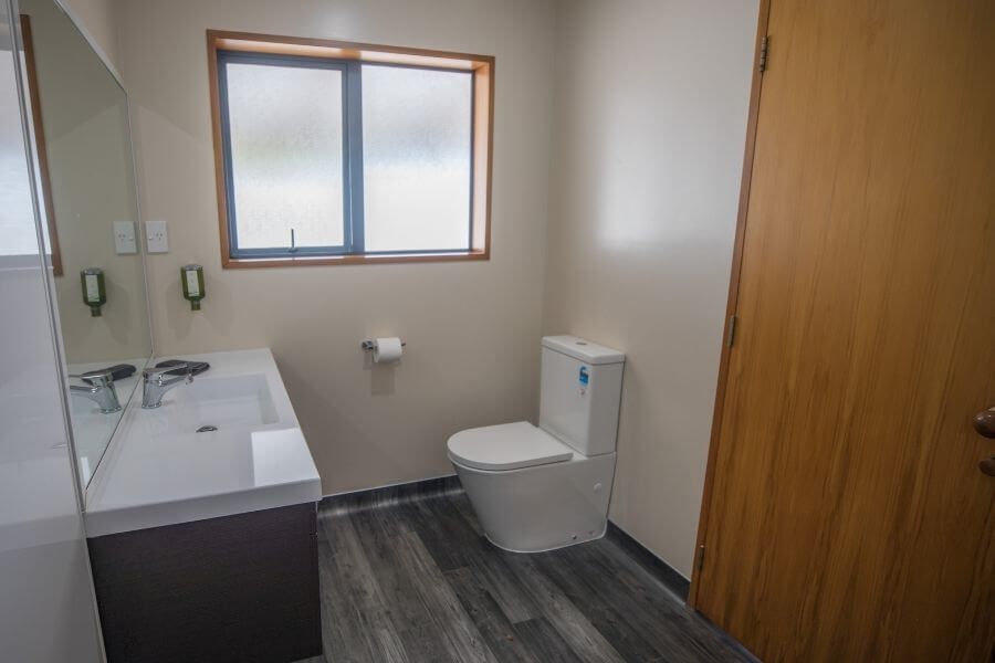 Vanity and toilet in 1-bedroom unit at Mt Cook View Motel in Fox Glacier